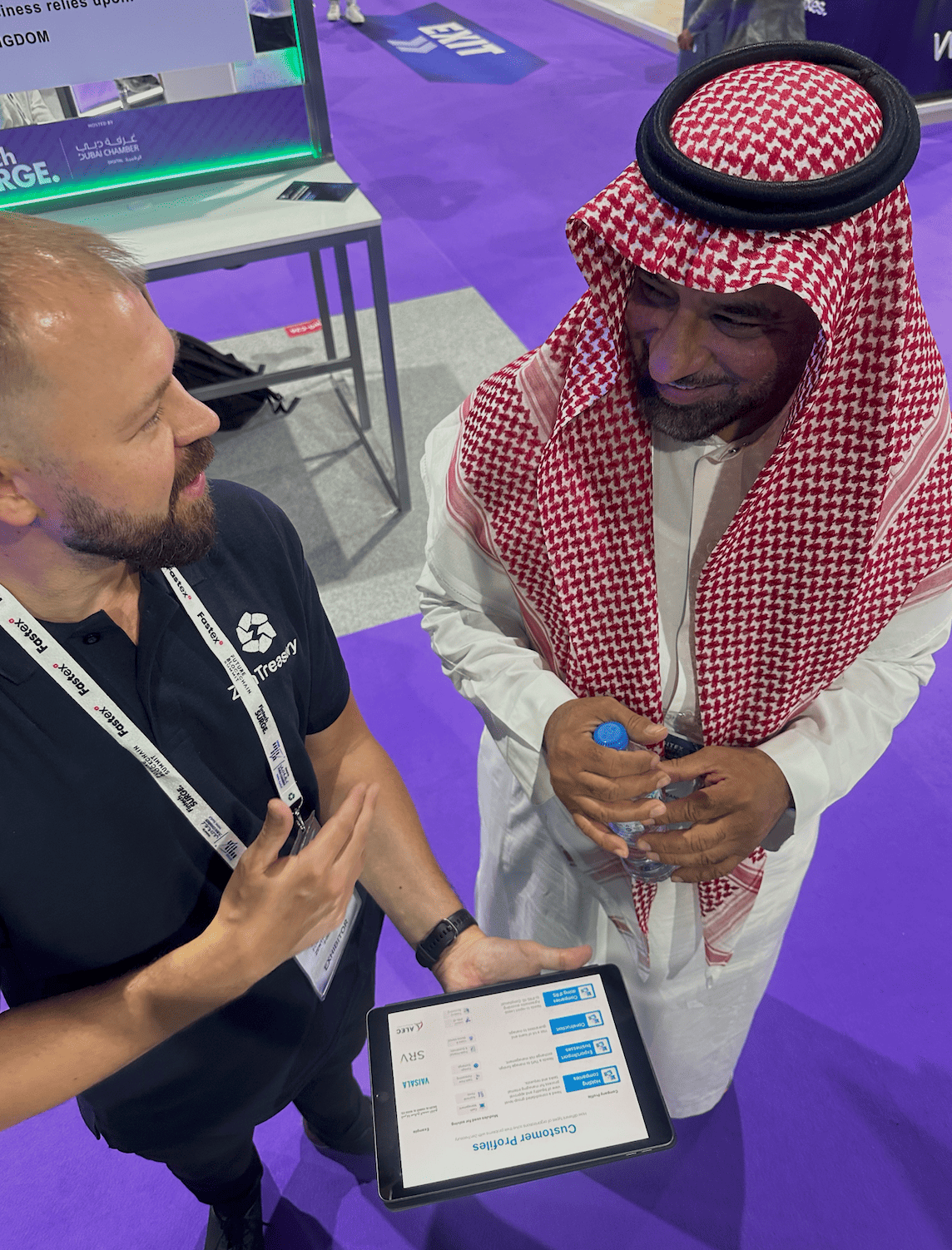 A ZenTreasury specialist walking a prospect through the platform in Dubai